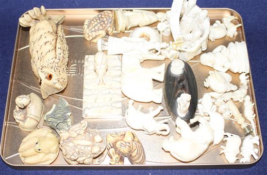 A group of assorted pre WWII ivory carving, mostly animals, together with several resin carvings